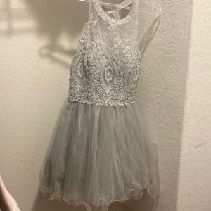 the brand is cinderella divine, in a size m, it’s a gray dress